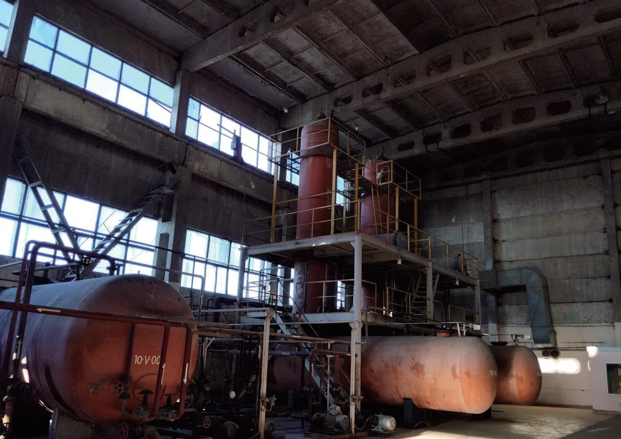 Wide view of red vessels and process equipment inside Reftech’s industrial facility